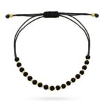 Bransoletka złote i czarne kuleczki na czarnym sznurku