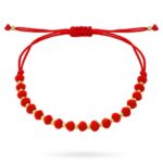 Bransoletka złote kulki oraz czerwone kamienie na czerwonym sznurku